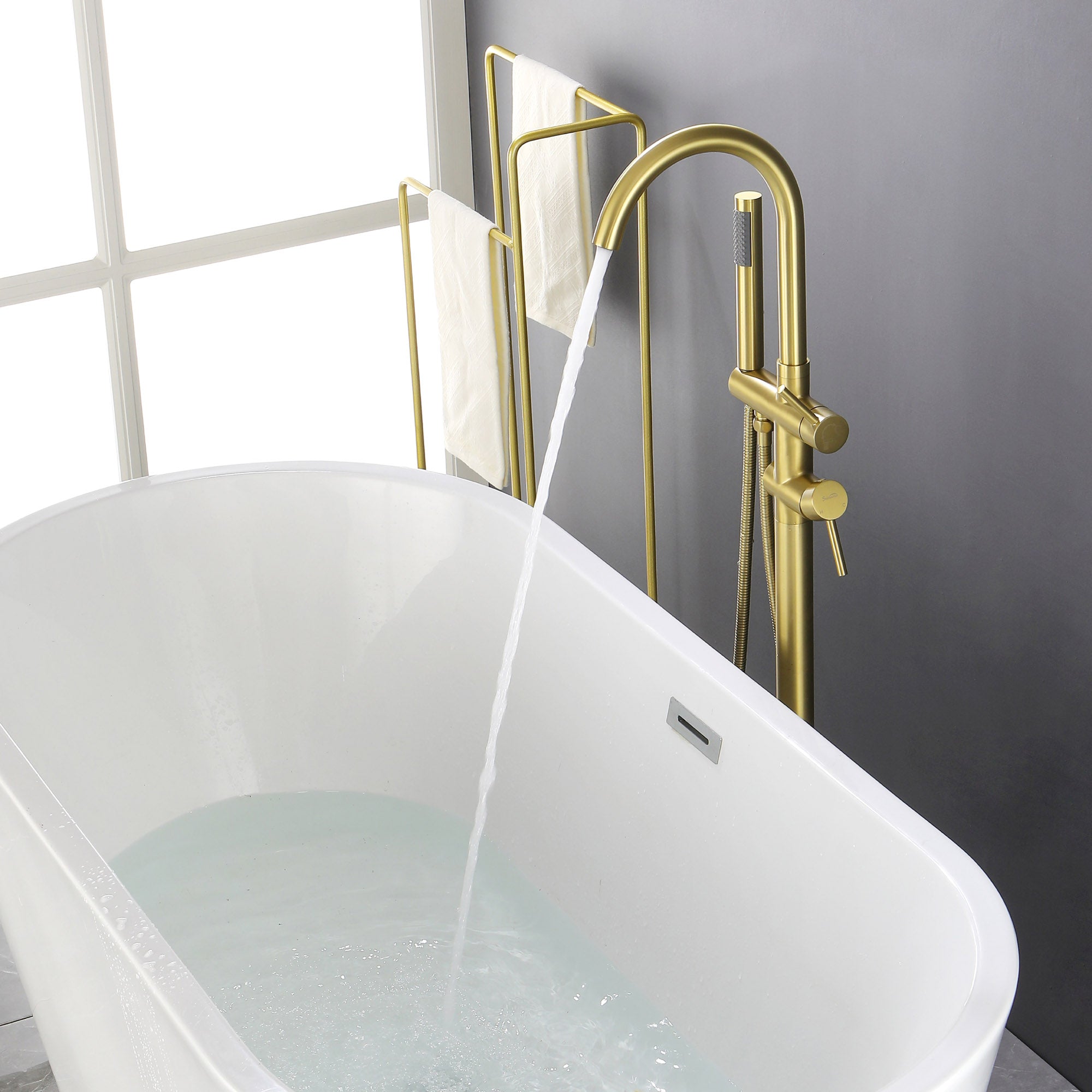 Floor-mounted tub filler with hand shower