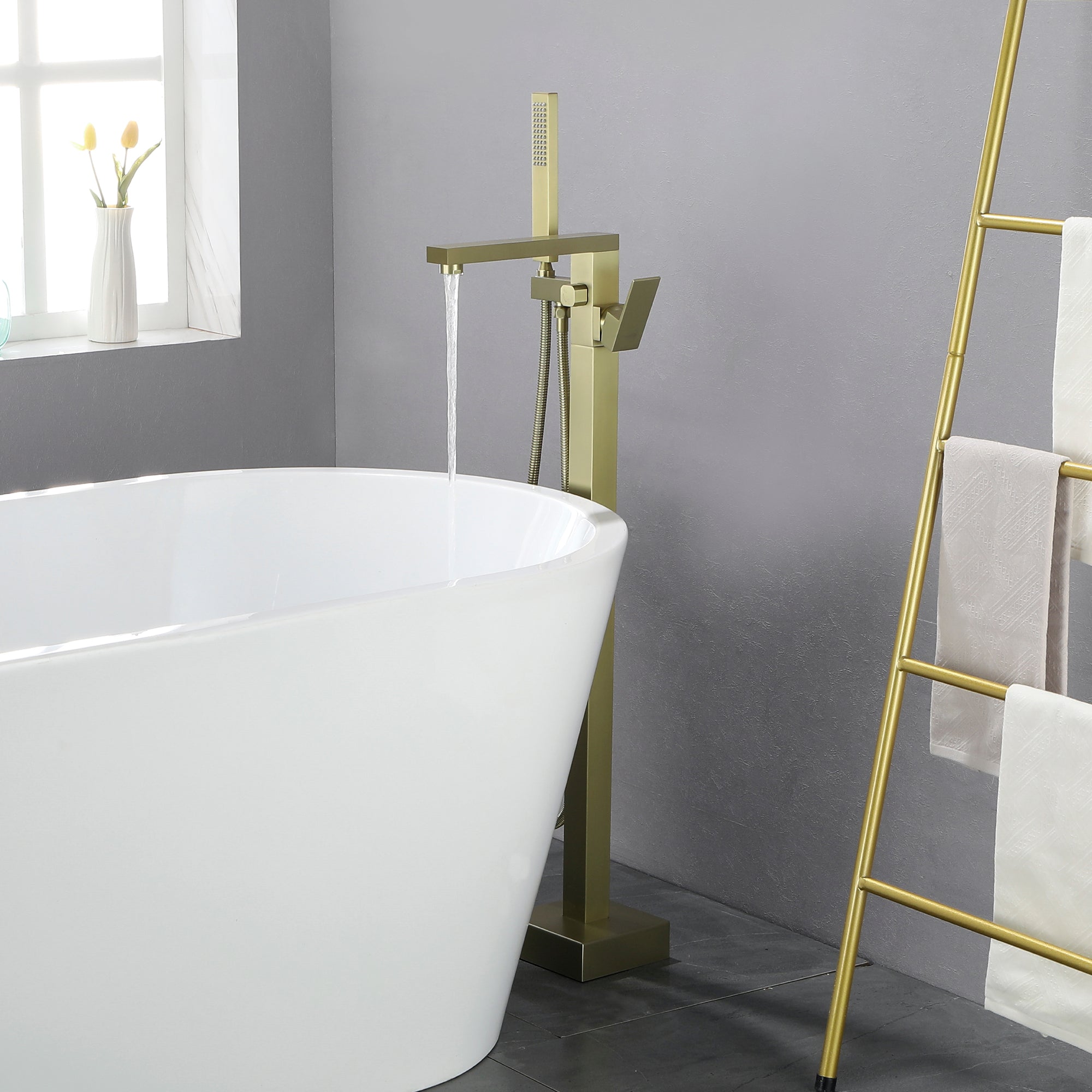 Freestanding tub filler with handheld shower